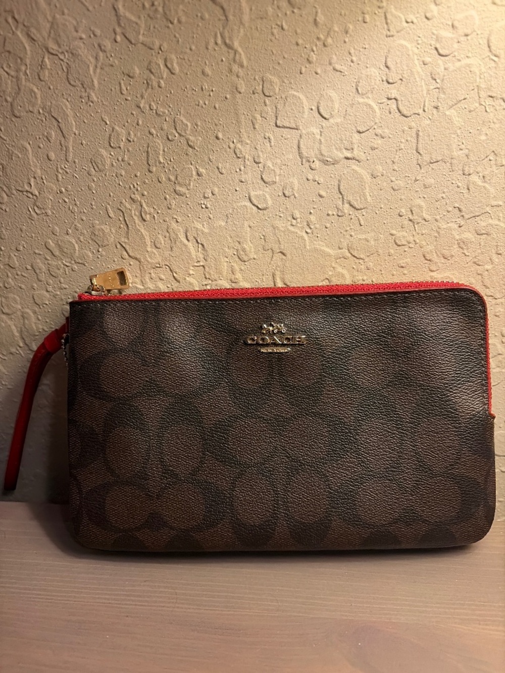 Coach wristlet - monogram brown and red